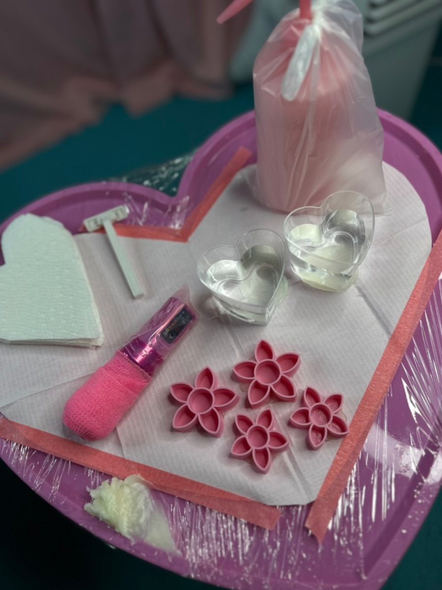 Tia Berry's pink heart tattoo station setup