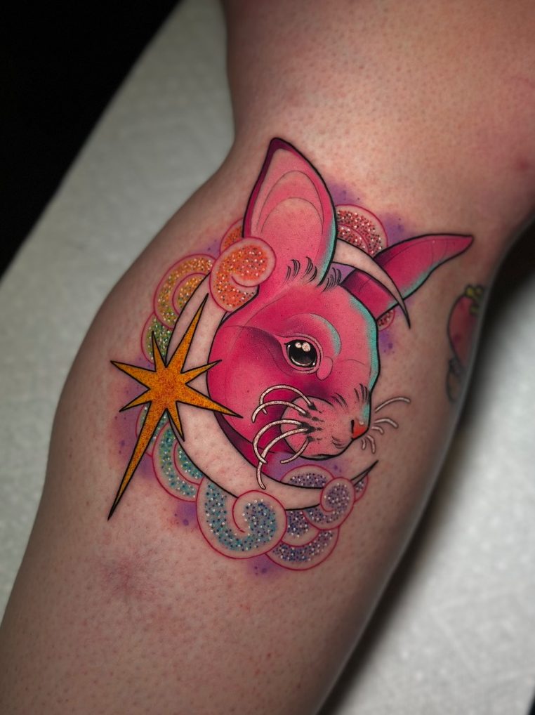 Pink rabbit and moon tattoo on the calf by Tia Berry, colour tattoo artist in Vancouver
